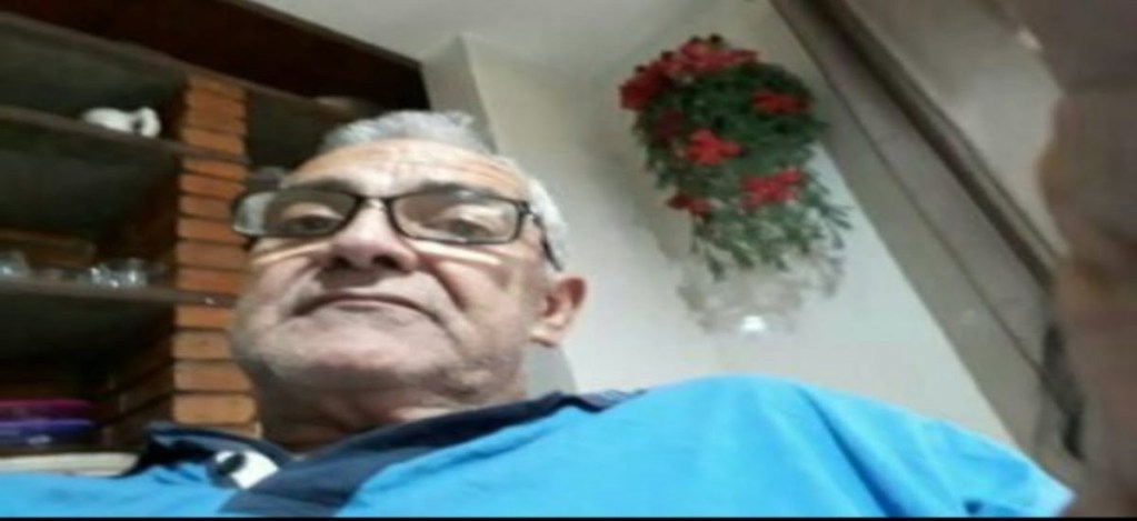 My father sitting in a chair, calm and reflective,, represents what he means to me.